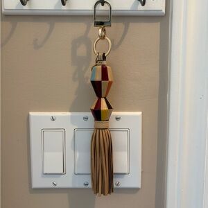 Tory Burch striped leather and wood tassel bag charm